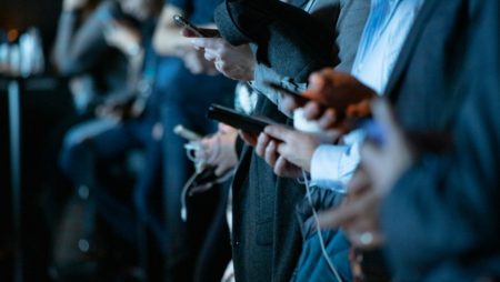 People looking at smartphones